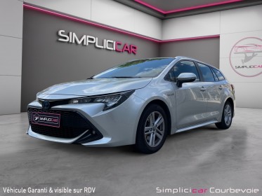 Toyota corolla touring sports hybride pro hybride 180h design garantie 12 mois occasion simplicicar courbevoie simplicicar...