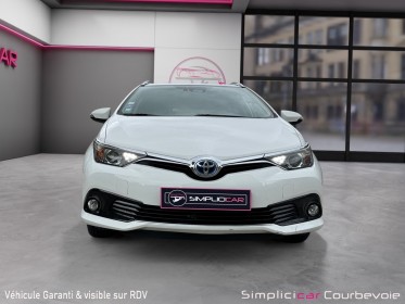 Toyota auris touring sports pro rc18 hybride pro 136h design - garantie 12 mois occasion simplicicar courbevoie simplicicar...