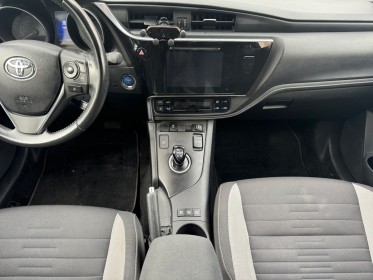 Toyota auris hybride 136h design business/gps/camera de recul/entretien toyota occasion simplicicar orgeval  simplicicar...