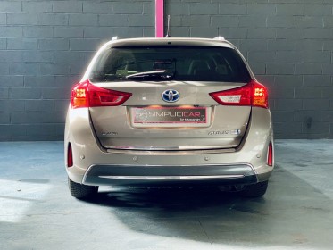 Toyota auris touring sports hybride 136h style- entretien toyota complet occasion simplicicar st-maximin simplicicar...